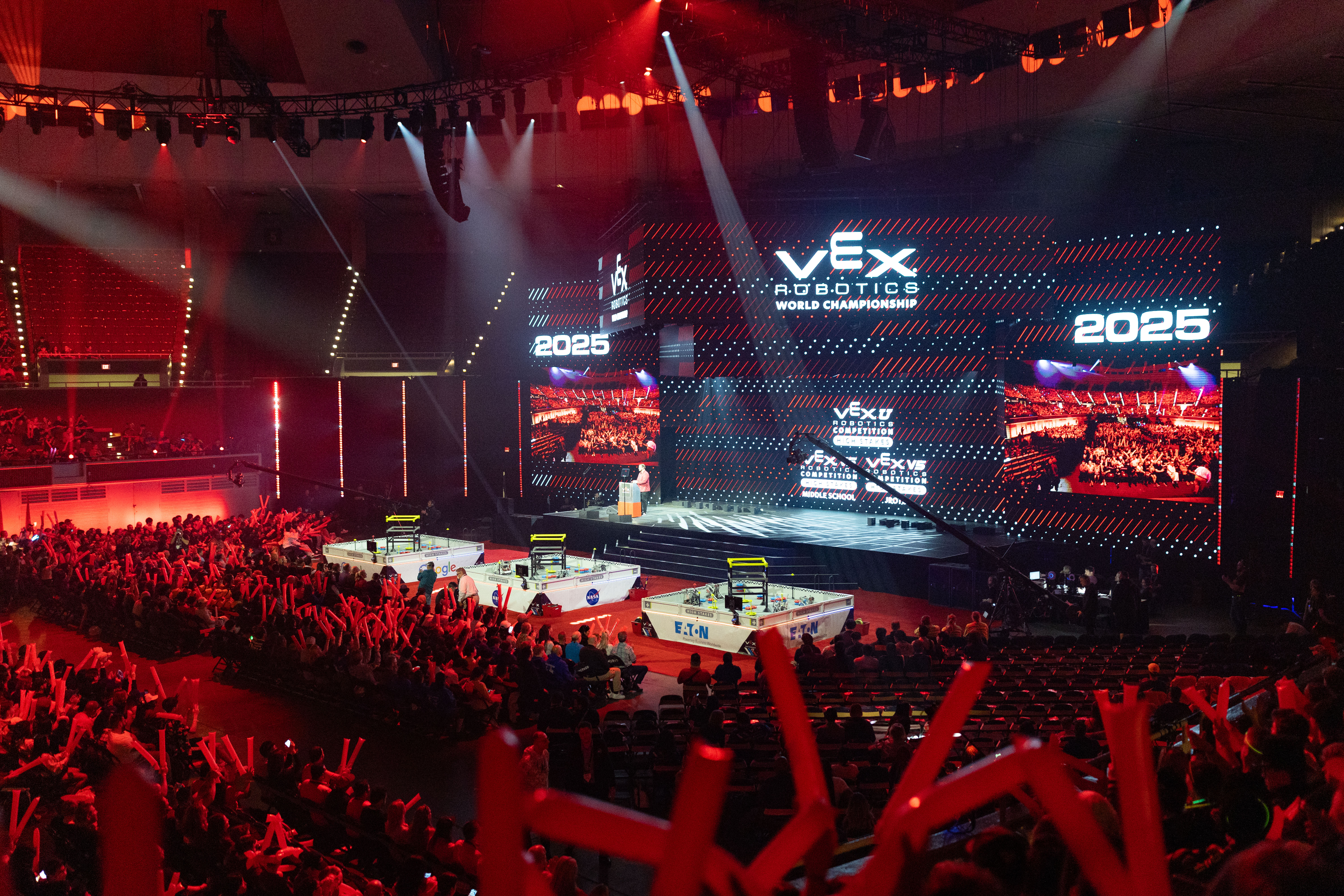 This is an image of a glossy skull in front of a wall of text that reads heads.